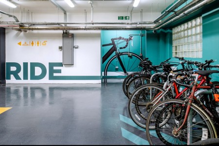 Prudential Buildings, Bristol - white and teale walls with bikes to the right