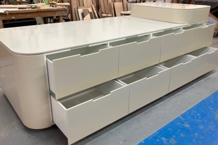 This mid floor unit made of High Macs, a solid surface material, which creates a seamless, sleek finish is completed and ready to go to a high-end retailer in Knightsbridge