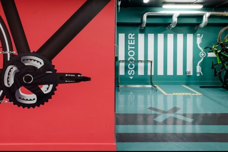 Prudential Buildings, Bristol - red wall with black bike graphic and teale floor and wall with scooter parking point