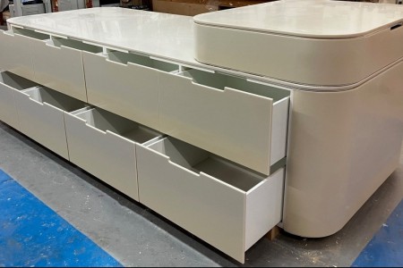 Made of High Macs, a solid surface material, which creates a seamless, sleek finish on this mid floor unit for a high-end retailer in Knightsbridge.