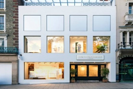 The White Company, Norwich - completely white exterior with large windows and black entrance doors