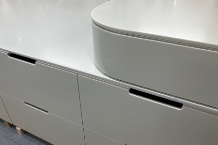 This mid floor unit made of High Macs, a solid surface material, which creates a seamless, sleek finish is completed and ready to go to a high-end retailer in Knightsbridge