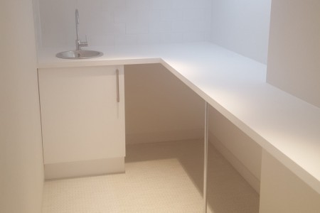 White modern sideboard and sink installed at Auerbach & Steele