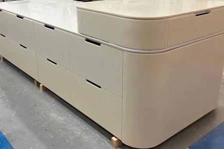 Made of High Macs, a solid surface material, which creates a seamless, sleek finish on this mid floor unit for a high-end retailer in Knightsbridge.