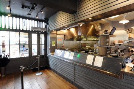 Shake Shack, Covent Garden - till area with grey panelling and rope barrier