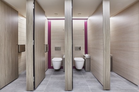 Princesshay Shopping Centre public toilets, Exeter - beige tiling on walls, wooden stalls with doors open revealing chrome fixtures and white toilets