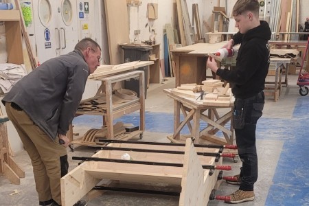 Using traditional joinery methods, here is Steve Gilbank a long serving Joiner of over 30 years showing our 2nd Year Apprentice Jamie how to construct and make a double staircase with kite winders. All constructed in engineered pine.