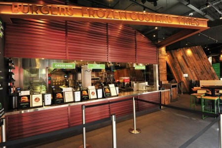 Shake Shack, New Oxford Street, London - till area, sign above tills with food options