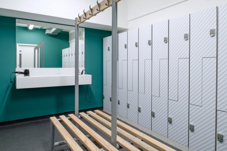 Prudential Buildings, Bristol - teale wall with mirrors and hairdryers on shelf, grey lockets and wooden bench