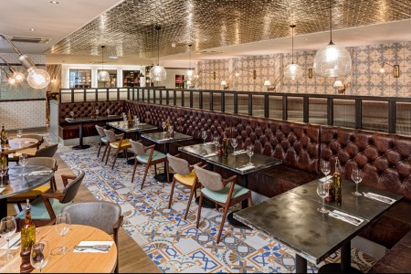 Wildwood, Crawley - mosaic flooring with brown leather bench seating