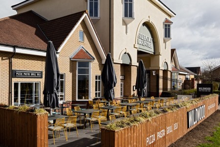 Wildwood, Braintree - exterior of building with logo on planters and walls