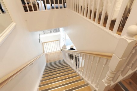 The White Company, Stamford - bespoke wooden joinery on staircase, white details