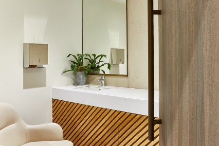 Princesshay Shopping Centre public toilets, Exeter - door open revealing sink, wooden panelling underneath, chrome fittings and a white chair