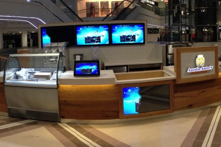 Bespoke shop fittings include counters and signage